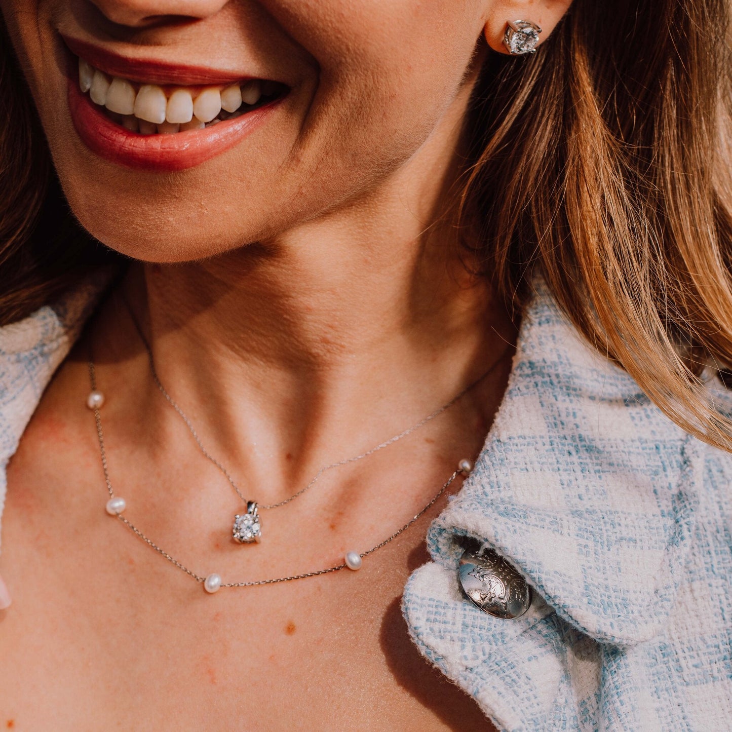 Timeless Elegance diamond solitaire necklace worn on neckline